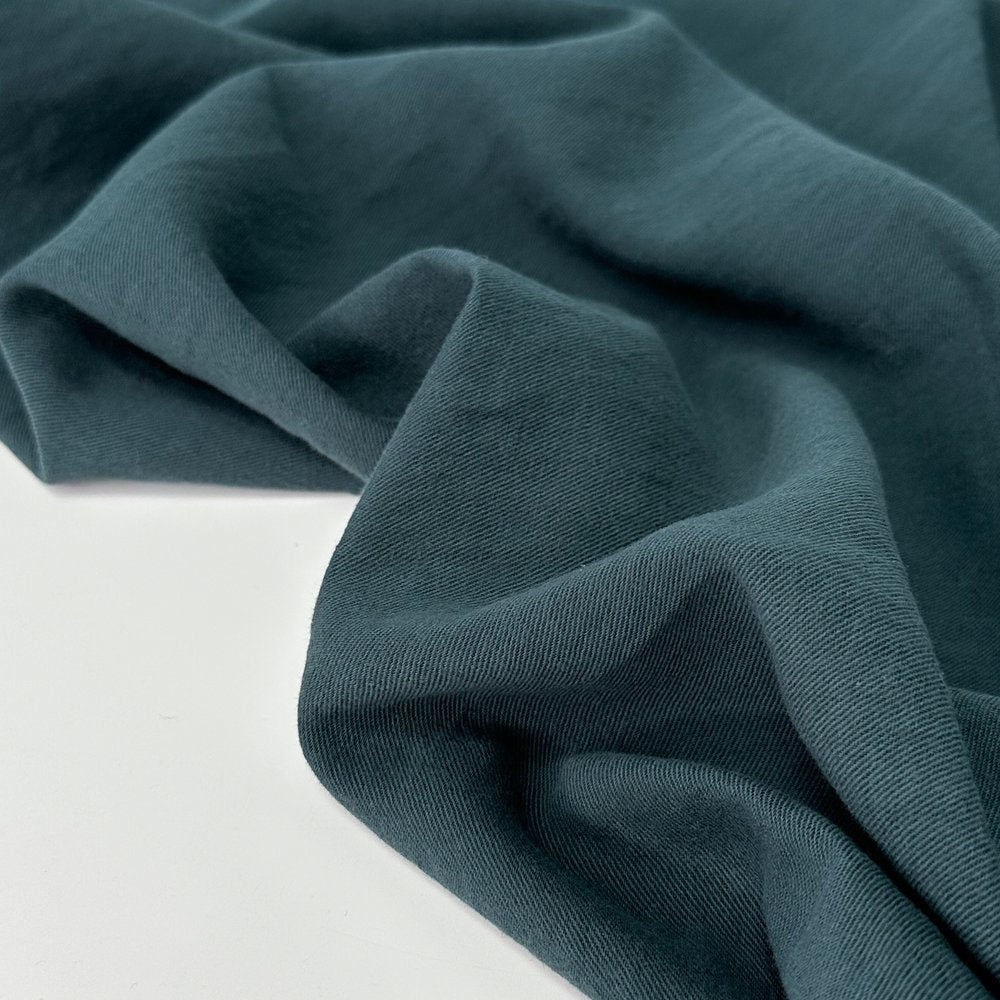 linen organic cotton blend fabric in a deep teal color