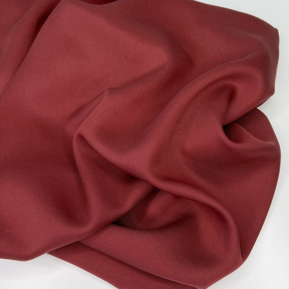 lyocell twill fabric in a auburn red color.